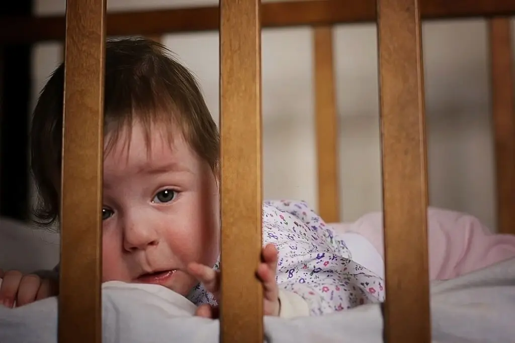 how to prevent baby from hitting head on crib