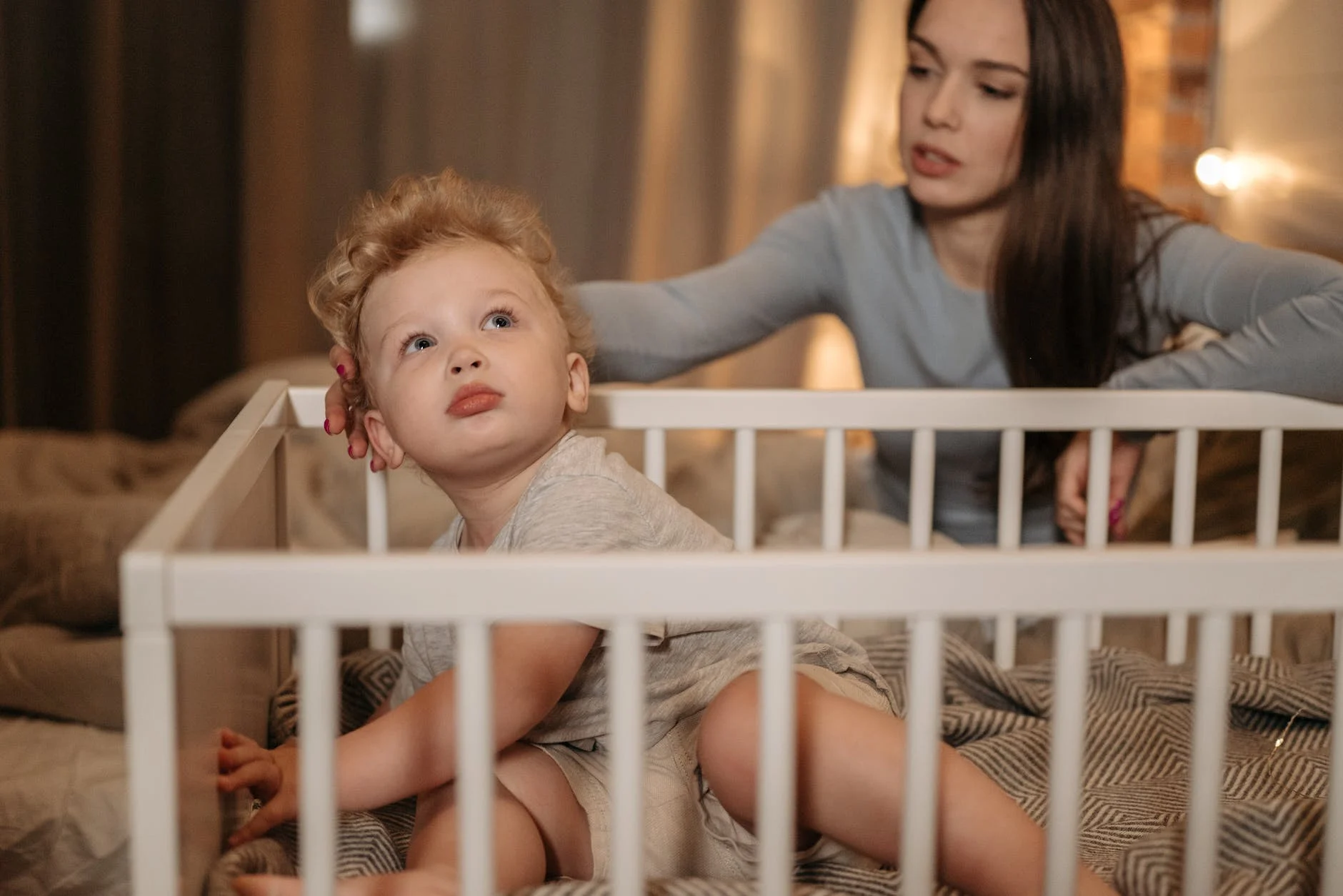 how to prevent baby from hitting head on crib